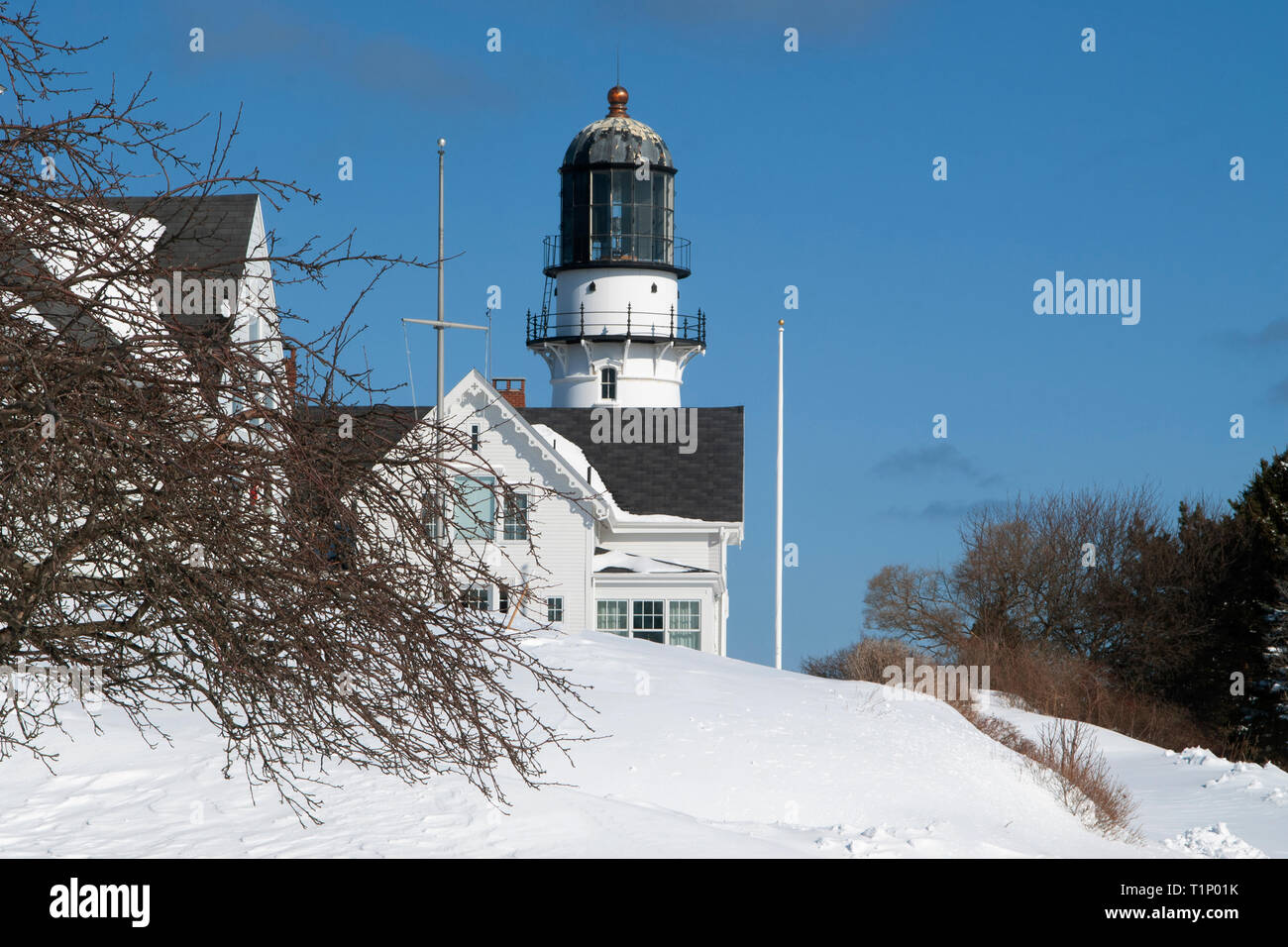 Cape Elizabeth lighthouse in Southern Maine is covered in snow from a passing new England Storm. Stock Photo
