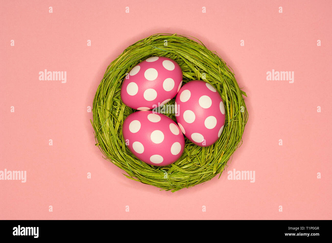 colored easter eggs in a green nest Stock Photo
