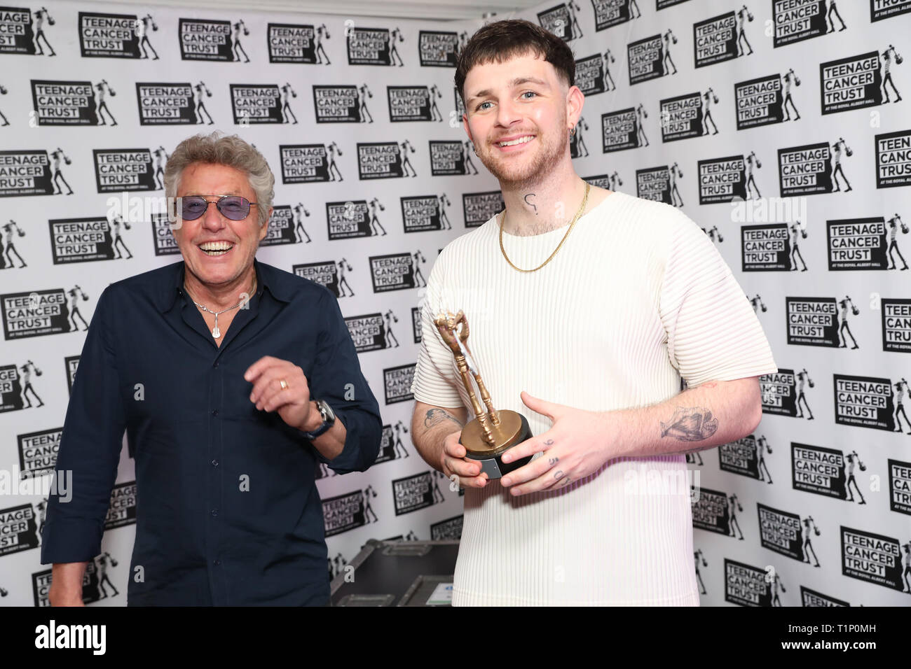 TCT's Honorary Patron Roger Daltrey CBE gives an award to Tom Grennan ahead of his performance at the Teenage Cancer Trust Concert, Royal Albert Hall, London. PRESS ASSOCIATION. Picture date: Wednesday March 27, 2019. See PA story SHOWBIZ TCT. Photo credit should read: Isabel Infantes/PA Wire Stock Photo