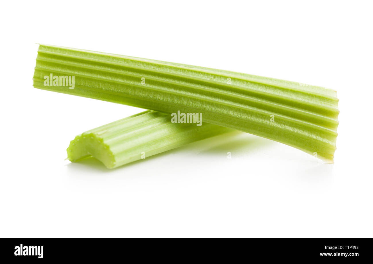 Celery sticks. Cutting celery stalks isolated on white background. Stock Photo