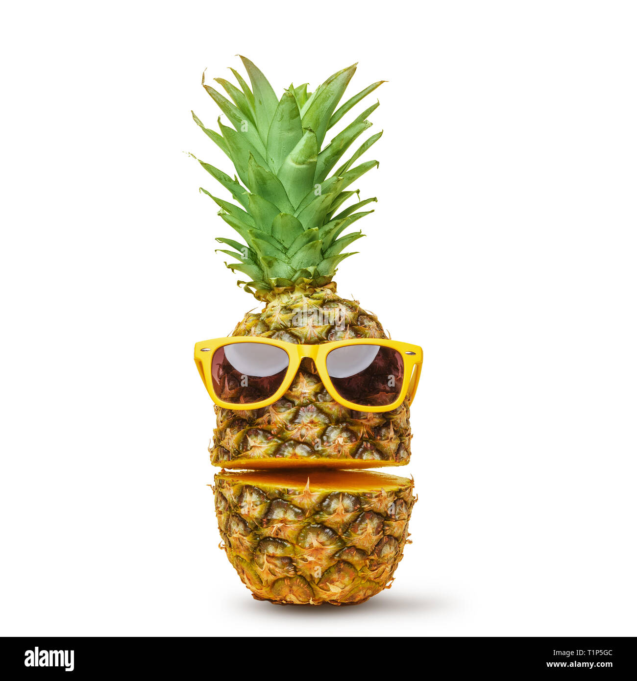 Juicy pineapple in sunglasses, cut into parts on a white background. Summer mood. Isolated. Stock Photo