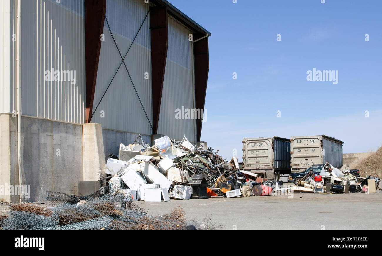 Pile of scrap metal for recycling at town landfill including old appliances in Bourne, Massachusetts USA Stock Photo