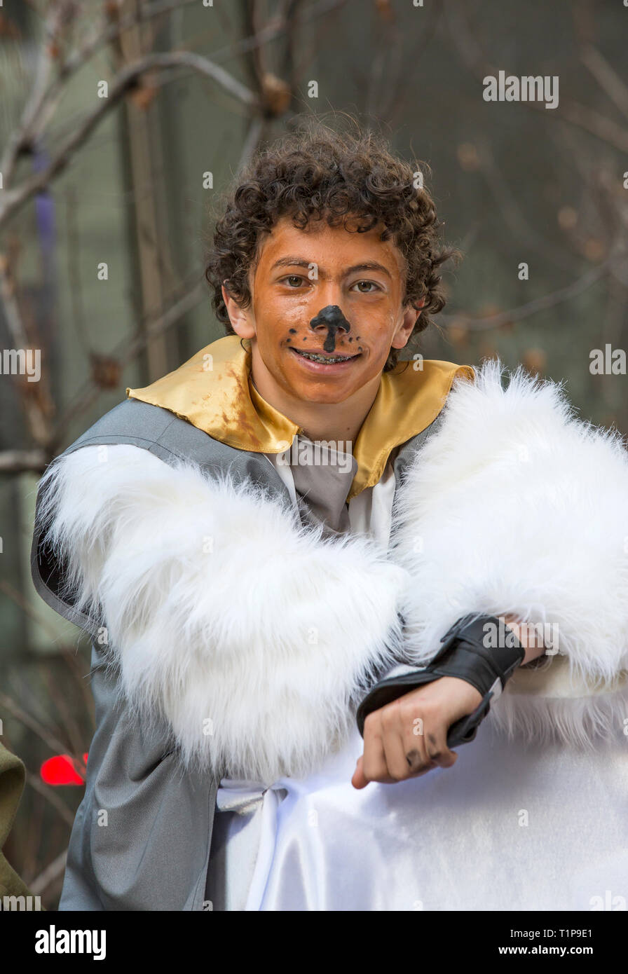 Young man with dog face makeup in costume for annual Chinese New Year Parade in San Francisco, California, USA Stock Photo
