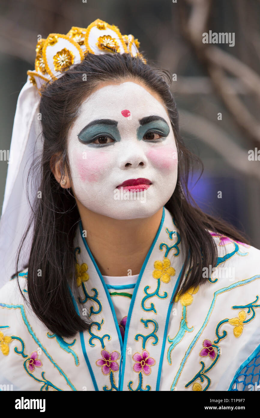 Woman in costume and face makeup at annual Chinese New Year Parade on Market Street, San Francisco, California, USA Stock Photo