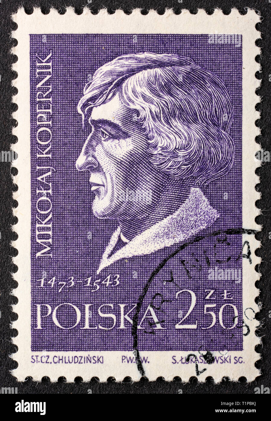 Nicolaus Copernicus (Mikołaj Kopernik), astronomer,  portrait on a vintage, canceled post stamp from Poland (circa 1959). Stock Photo