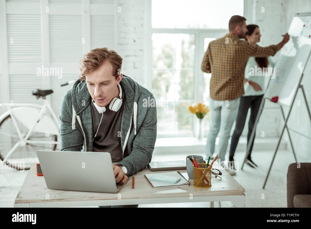 Smart young man working on the computer Stock Photo - Alamy