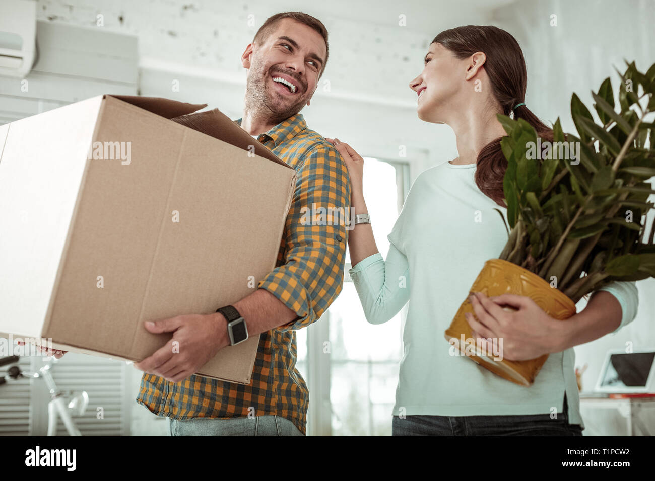 Friendly young people smiling to each other Stock Photo