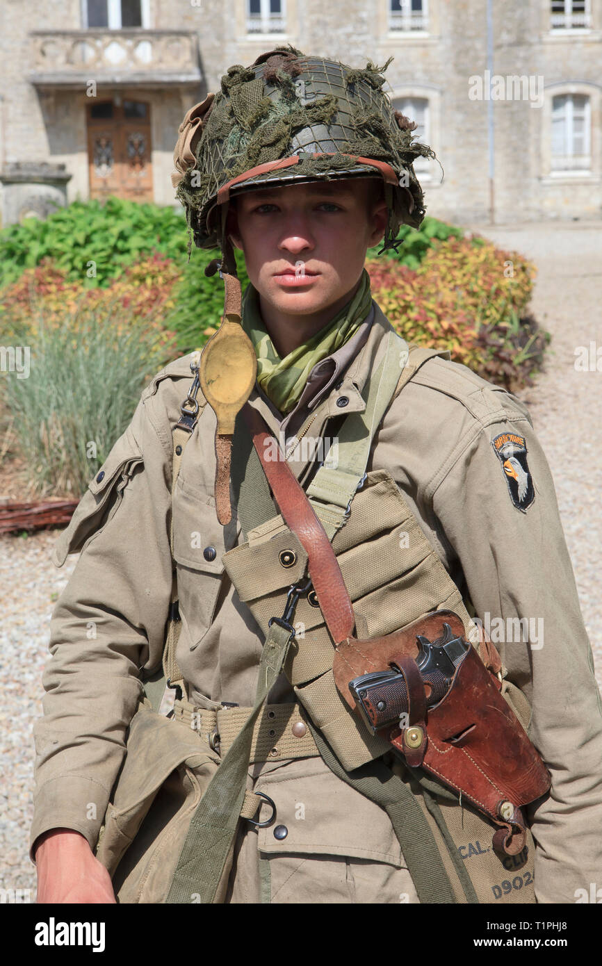 A private of the 101st Airborne Division armed with a M1911 pistol during the D-Day celebrations in Normandy, France Stock Photo