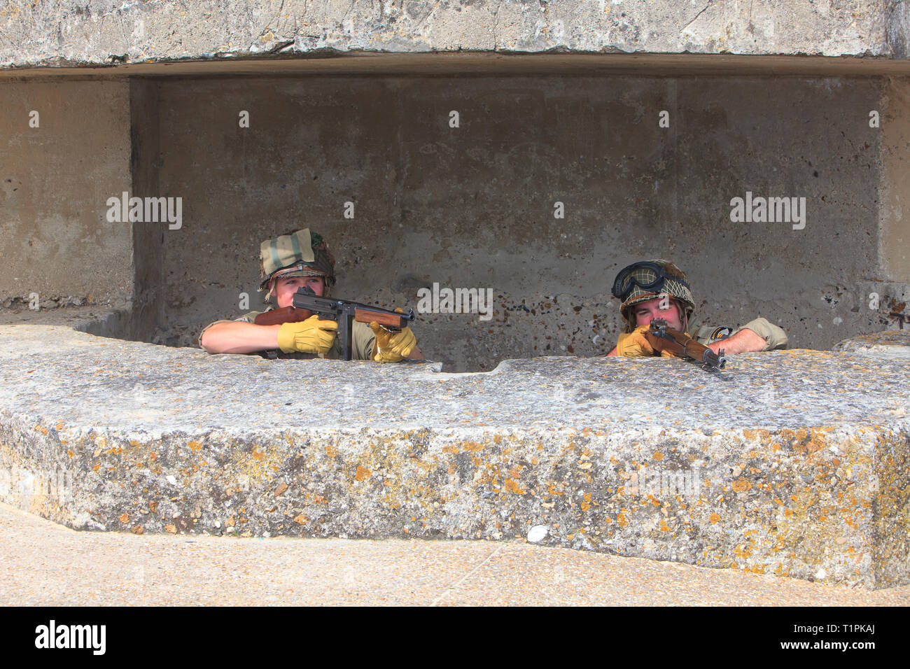2 soldiers of the 101st Airborne Division in a bunker during the D-Day commemorations in Normandy, France Stock Photo