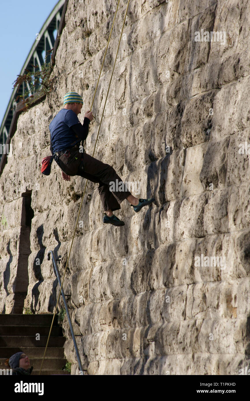 Cologne, Germany - February 02, 2014: A climber practices or tests his equipment while climbing on a pillar of the Hohenzollern Bridge on February 02, Stock Photo