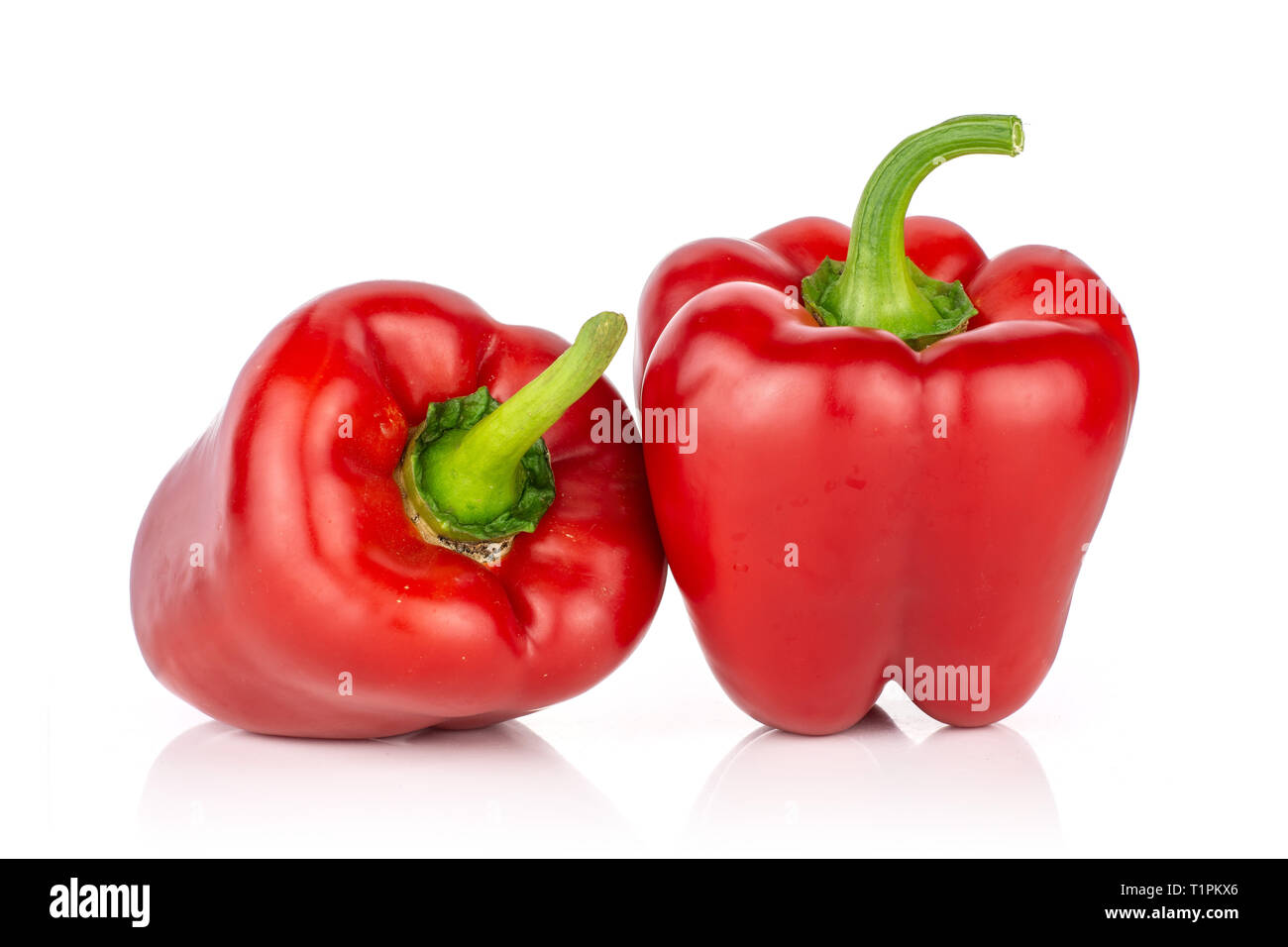 Group of two whole bulgarian red bell pepper isolated on white ...