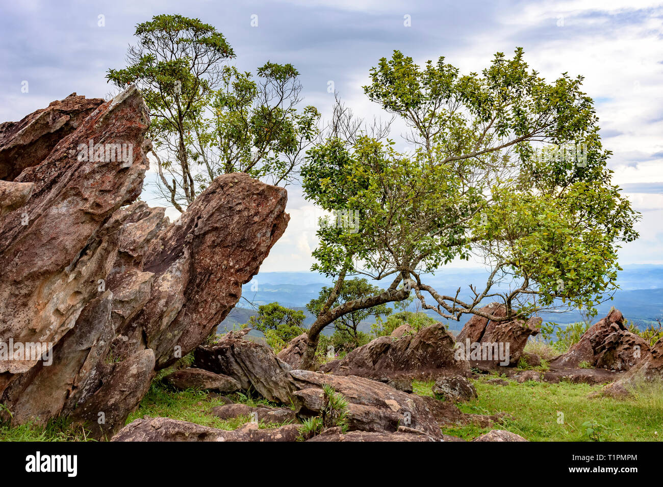Rock formations and vegetation between the mountains and valleys of Nova Lima in the state of Minas Gerais, Brazil Stock Photo