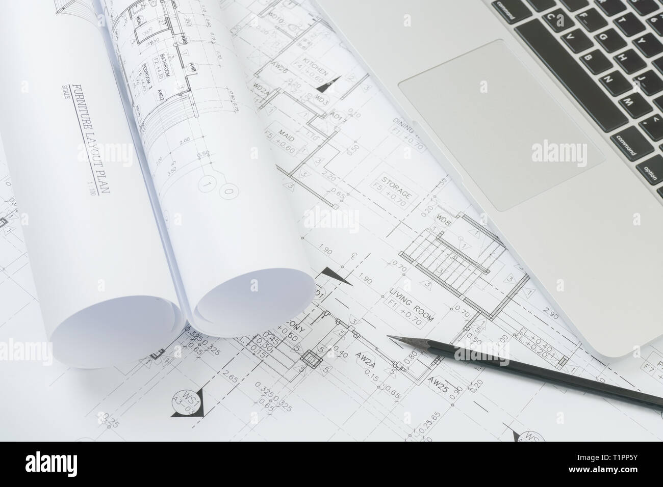 black pencil and computer laptop on architectural drawing paper for ...
