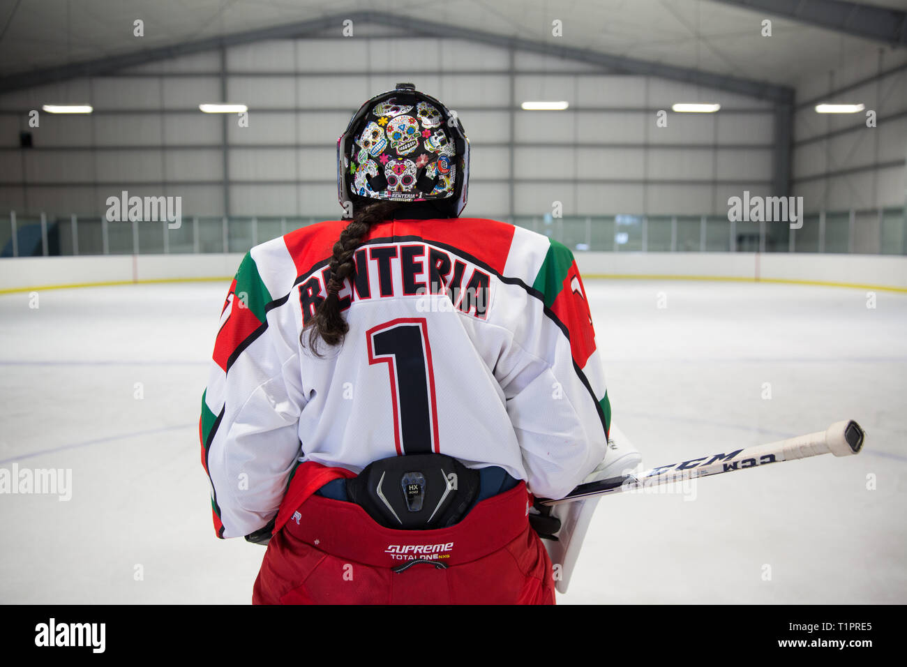 Mónica Evangelina Renteria Peñafort, 31, one of the goalkeepers of the Selección femenil de México de hockey sobre hielo, after a training session over the course of a 3-day intensive training week-end at the Winter Sports Center Metepec in Metepec, State of Mexico, Mexico on March 9, 2019. Mónica had her helmet customized in Canada with skulls reminiscent of the traditional Day of the Dead festival in Mexico. Mónica lives in Campestre Churubusco neighborhood in Mexico City, with her family. She studied gastronomy and culinary art. She is now a coach to goalkeepers at different ice hockey club Stock Photo