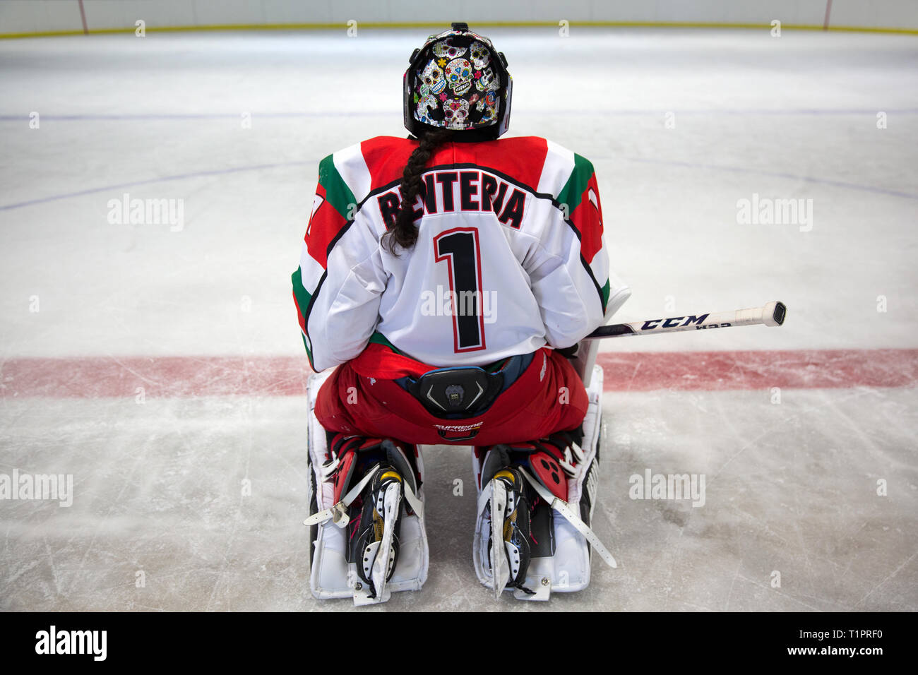 Mónica Evangelina Renteria Peñafort, 31, one of the goalkeepers of the Selección femenil de México de hockey sobre hielo, after a training session over the course of a 3-day intensive training week-end at the Winter Sports Center Metepec in Metepec, State of Mexico, Mexico on March 9, 2019. Mónica had her helmet customized in Canada with skulls reminiscent of the traditional Day of the Dead festival in Mexico. Mónica lives in Campestre Churubusco neighborhood in Mexico City, with her family. She studied gastronomy and culinary art. She is now a coach to goalkeepers at different ice hockey club Stock Photo