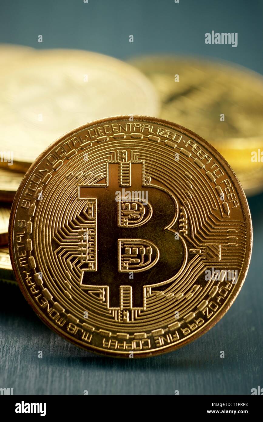 Bitcoins on a wood table. Stock Photo