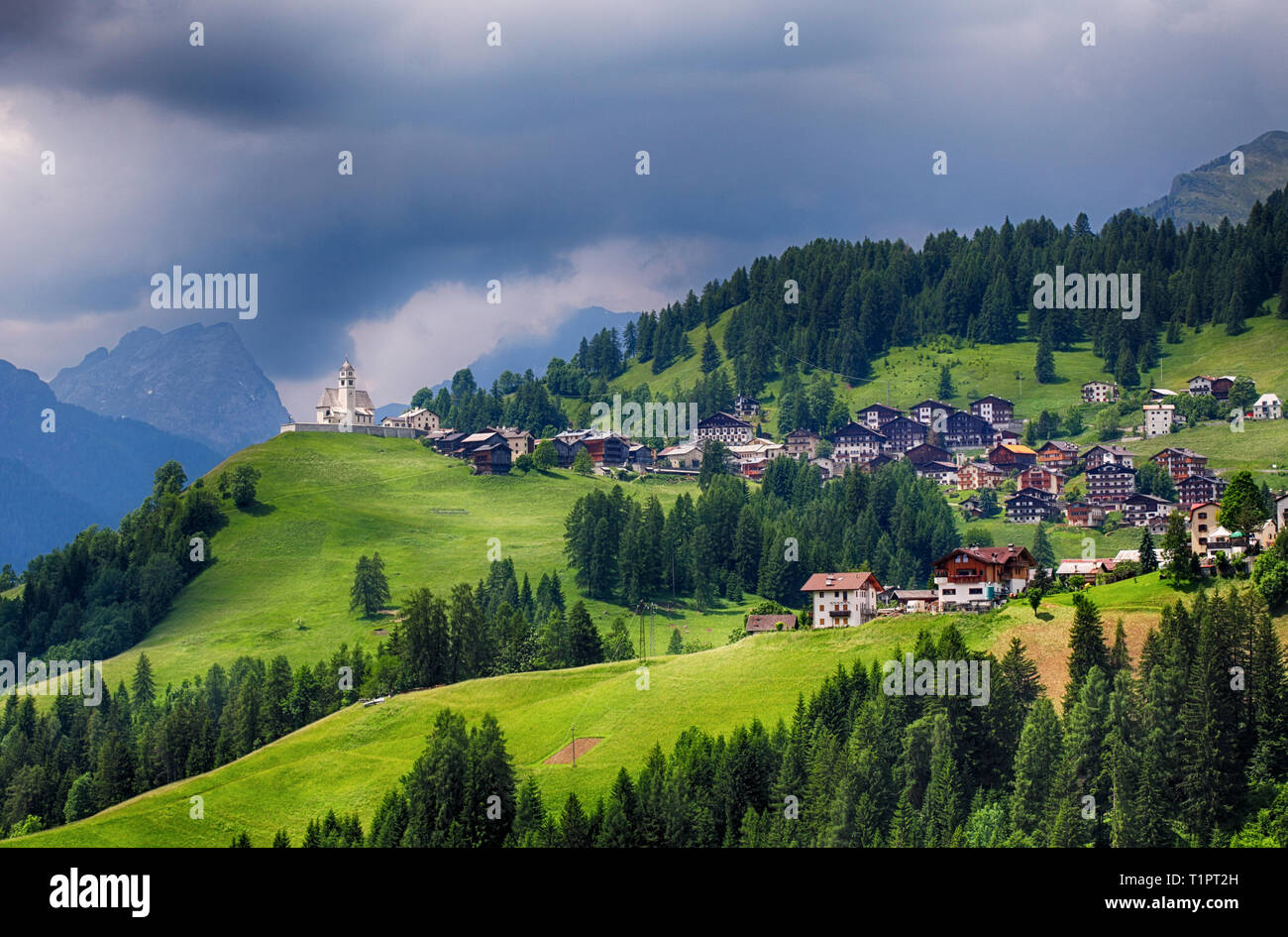 Mountain village with house in Dolomites Stock Photo