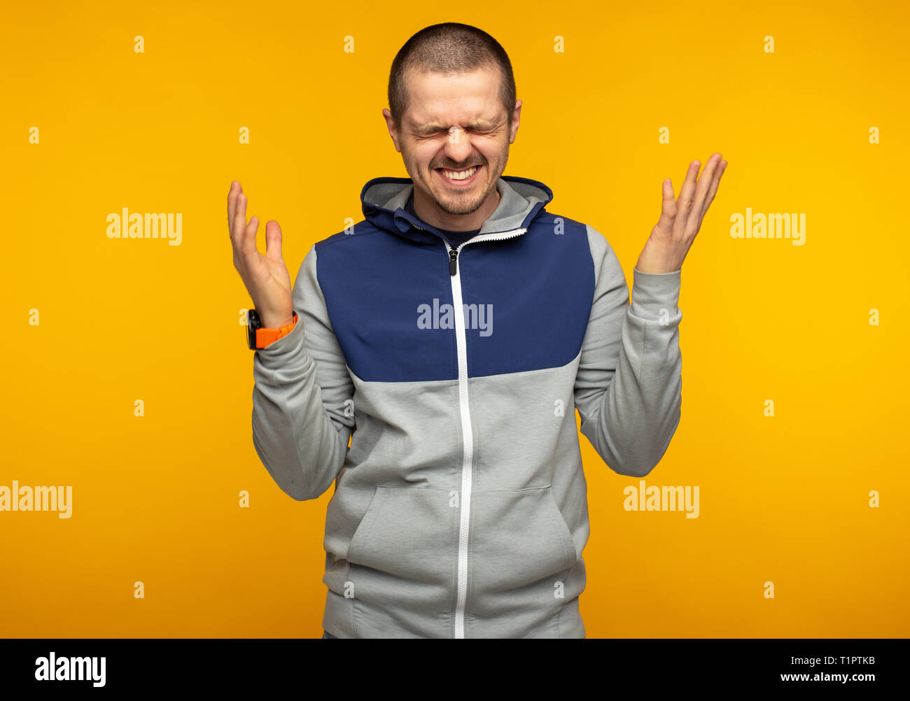 Happy laughting emotional man weared in hoodie Stock Photo