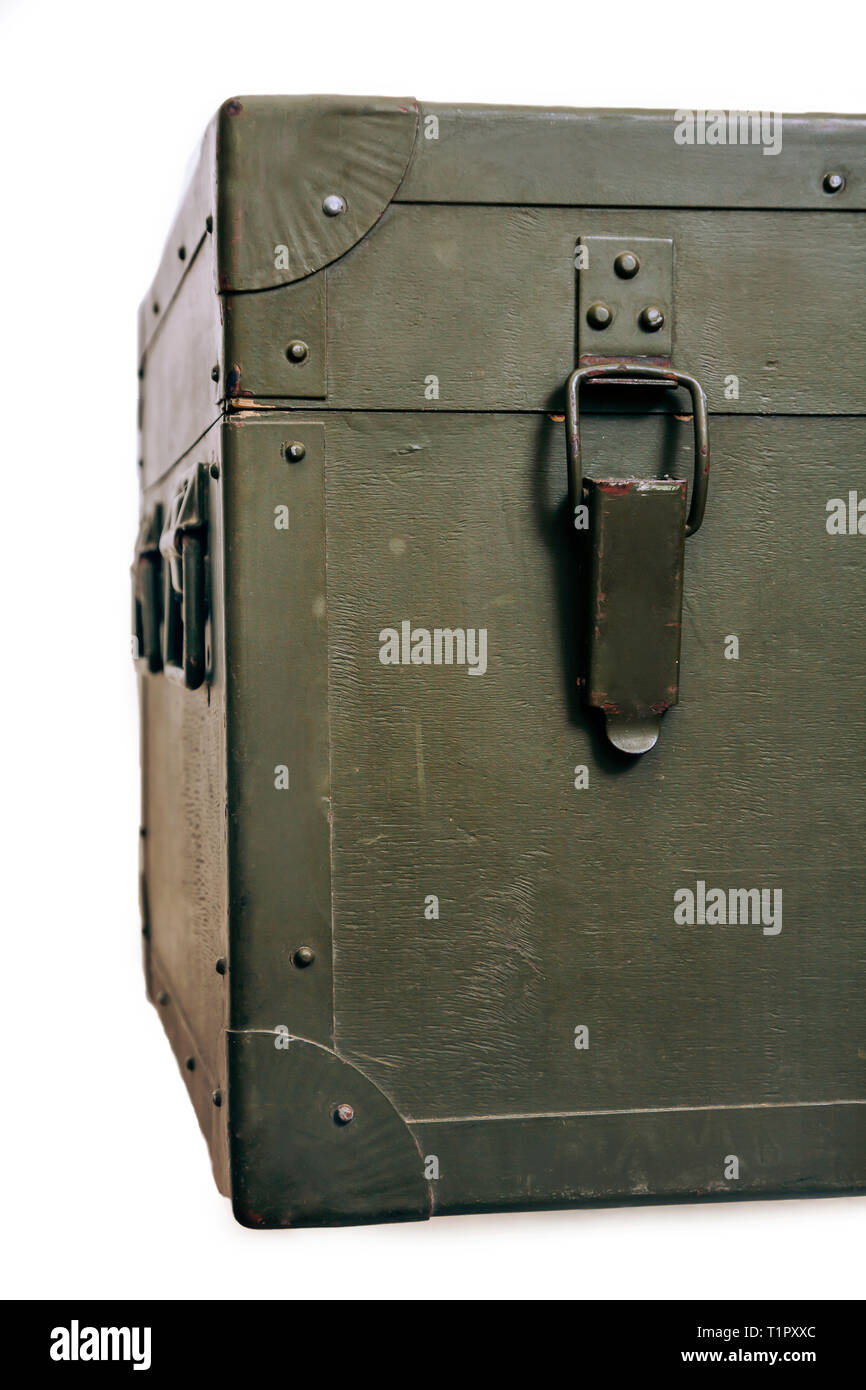 A green military storage box for ammunition. Green box from the war with scratches and locks in