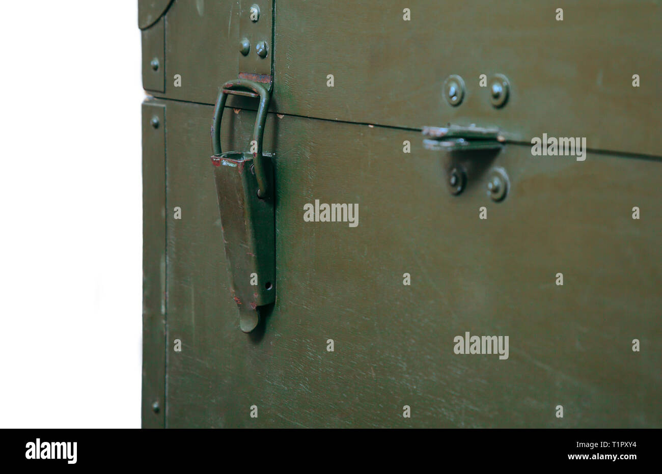A green military storage box for ammunition. Green box from the war with scratches and locks in