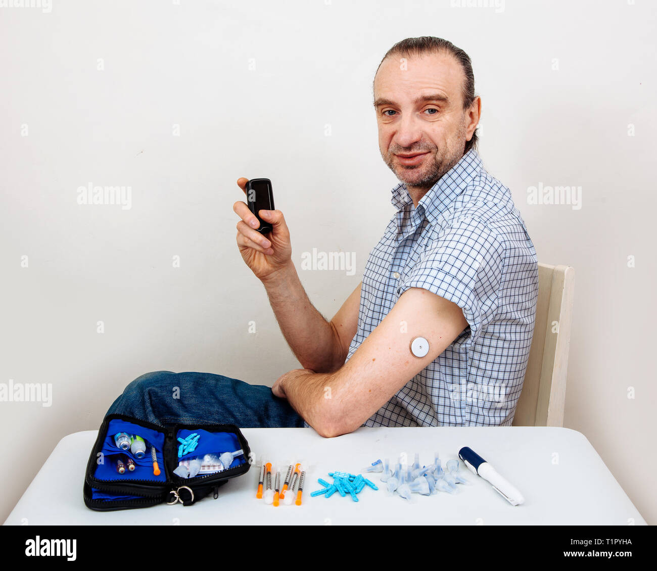 Man testing glucose level with a digital sensor checkup