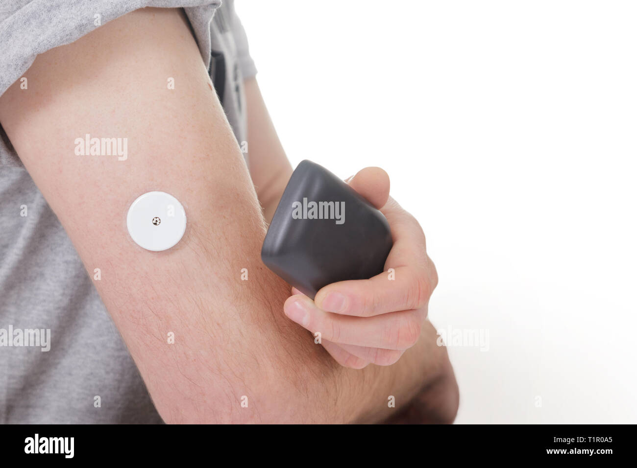Man testing glucose level with a digital sensor checkup
