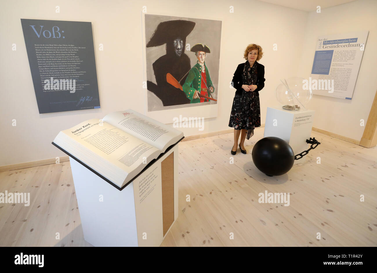 Penzlin, Germany. 25th Mar, 2019. Andrea Rudolph, director, stands in the exhibition 'Johann Heinrich Voß. A Greek from Mecklenburg' in the future Literaturhaus. The rebuilt and extended town school, in which Johann Heinrich Voss (1751-1826) learned from 1759-1766, is opened on 29.03.2019 as a literary house for the Homer translator. The most famous son of the city became known as a poet especially with translations of the 'Odyssey' and the 'Iliad', to which also the legend about the conquest of the ancient Troy belonged. Credit: Bernd Wüstneck/dpa/Alamy Live News Stock Photo