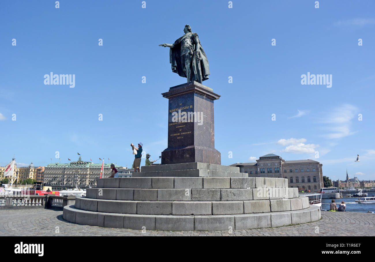 13 July 2018, Sweden, Stockholm: The statue of Gustav III, a bronze statue of the Swedish king Gustav III, stands in the Stockholm district of Gamla stan. The Swedish capital Stockholm comprises 14 islands of a large archipelago in the Baltic Sea, connected by more than 50 bridges. Photo: Holger Hollemann/dpa Stock Photo