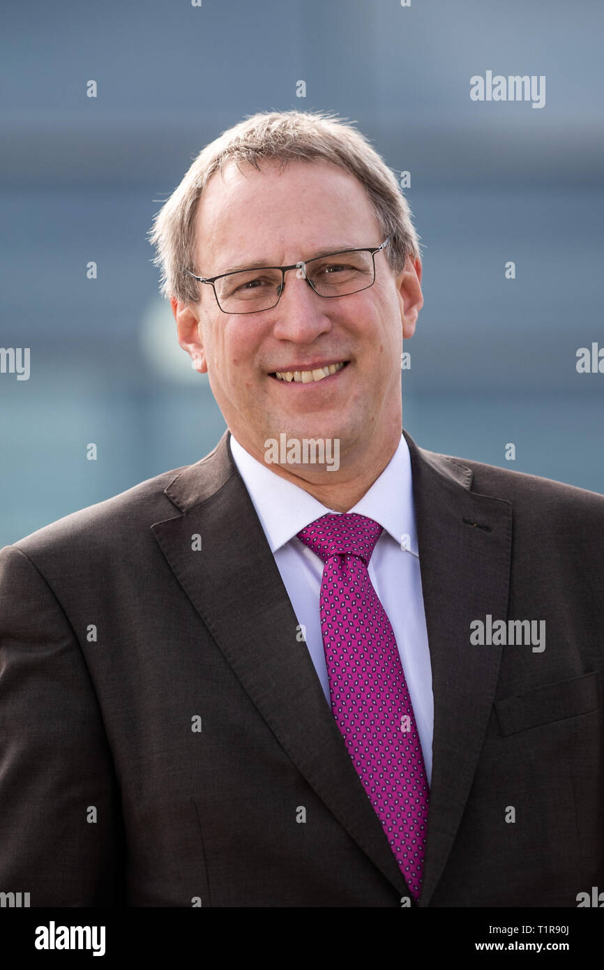 28 March 2019, Bavaria, Nürnberg: Michael Hupe, Managing Director of Albrecht Dürer Airport Nuremberg, stands on the edge of the annual parking lot on the apron. Photo: Daniel Karmann/dpa Stock Photo