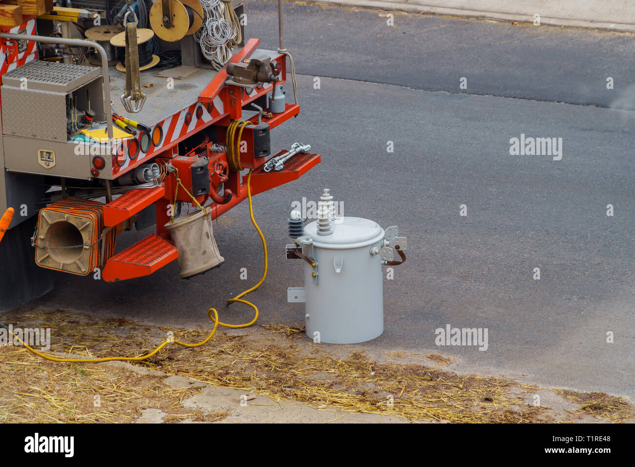 Power transformers are installed outside the after storm damaged electric transformer to convert low voltage electricity to control fixed Stock Photo