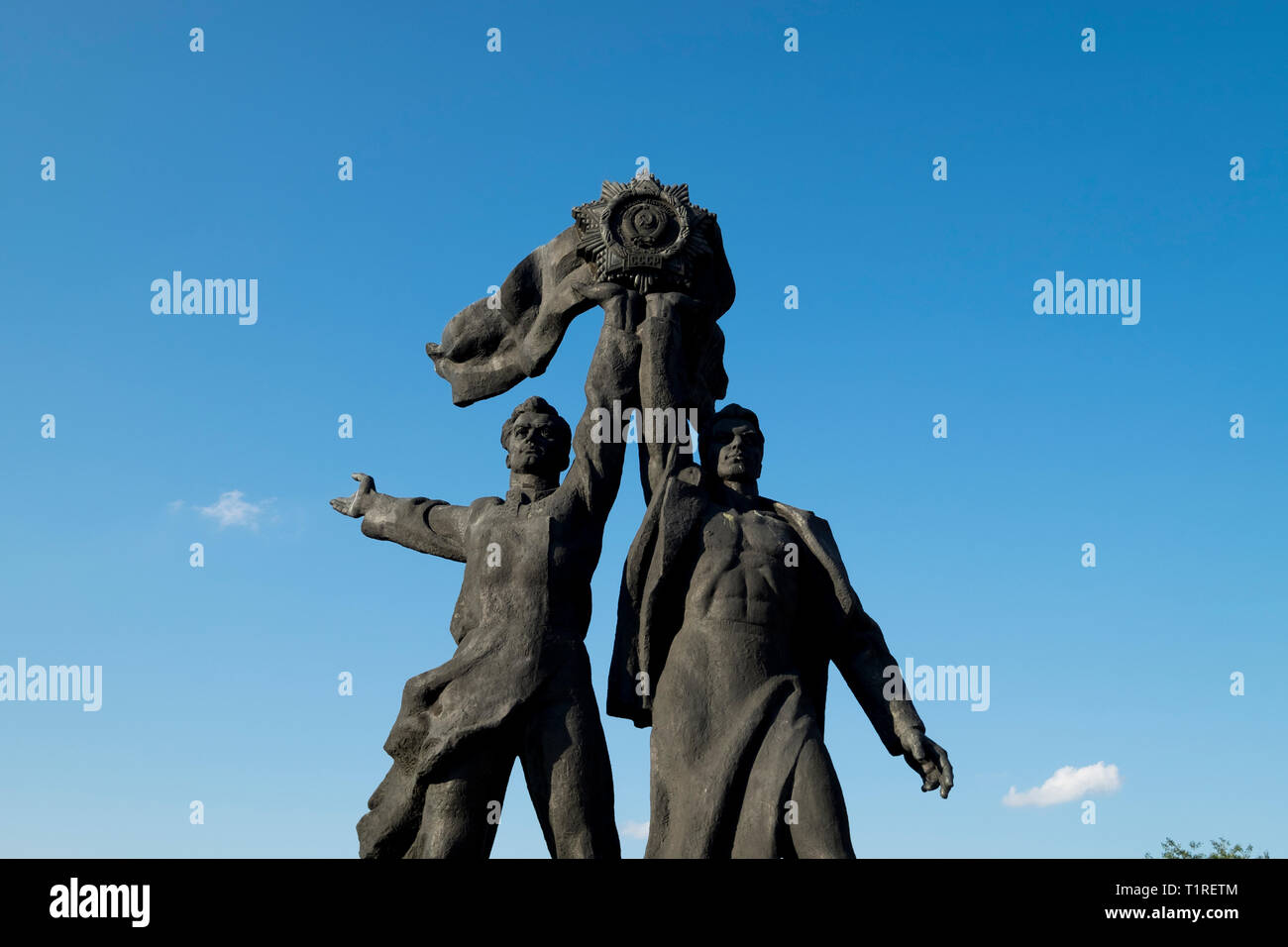 Ukraine and Russian worker statue at the foot of the stainless steel