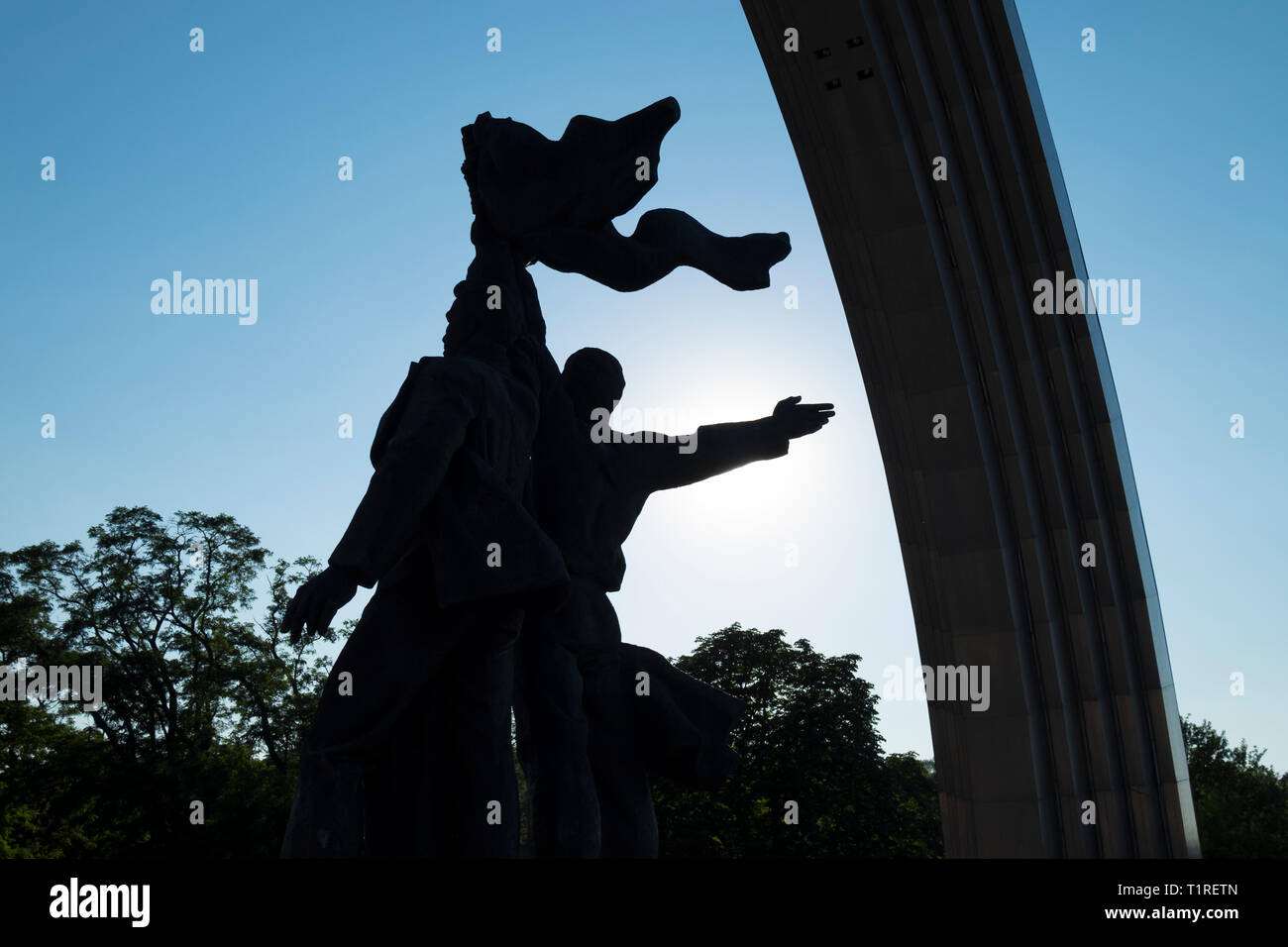 Ukraine and Russian worker statue at the foot of the stainless steel