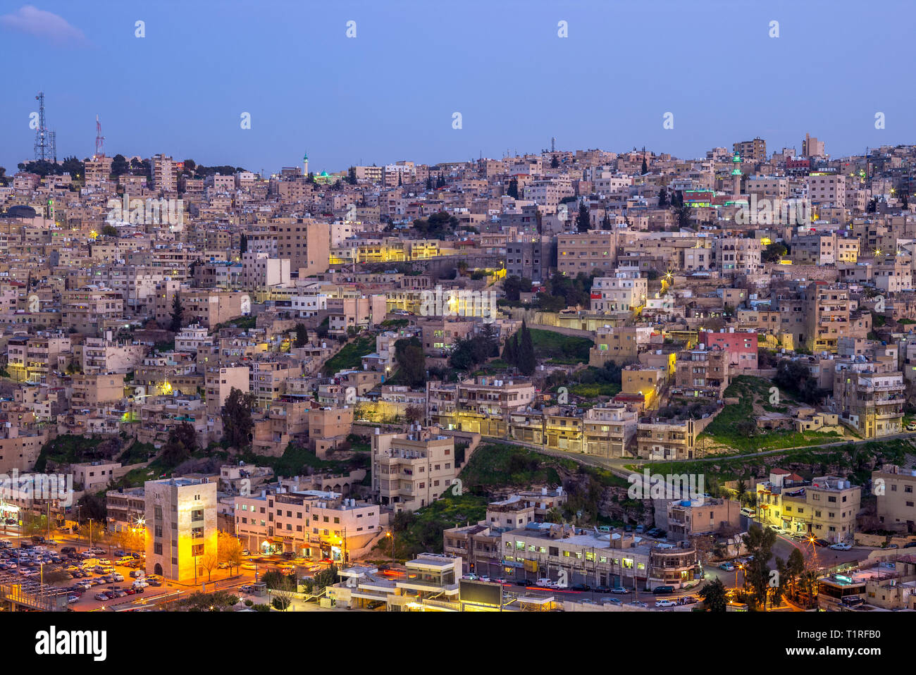 skyline of Amman, capital of Jordan, at dusk Stock Photo