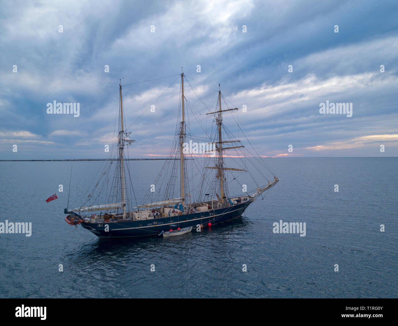 The sail training ship Leeuwin II anchored near Big Rat island in the
