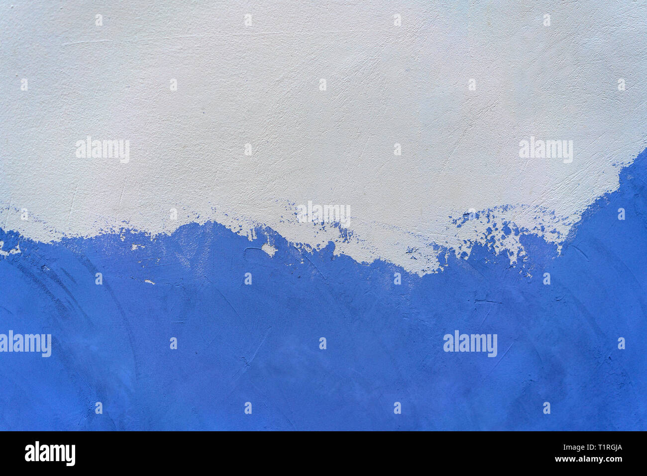 white and blue painted concrete wall. Stock Photo