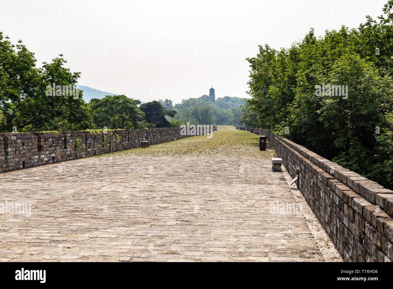 May 2017 - Nanjing, Jiangsu, China - a section of the old Ming Dynasty city walls near Jiming temple. Zijin mountain is visible far away. Nanjing has  Stock Photo