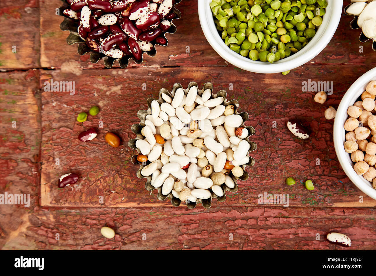 Bowls of various legumes red turkish lentils, chickpeas, beans, peanuts