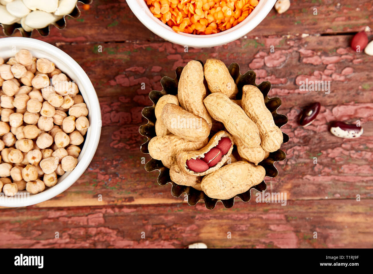 Bowls of various legumes red turkish lentils, chickpeas, beans, peanuts