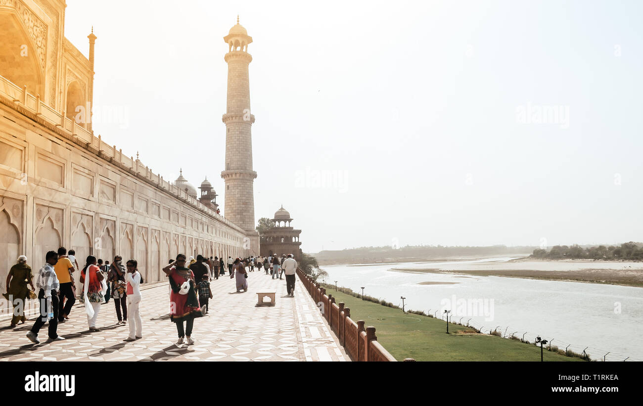 Taj Mahal, Agra, January 2019: Brilliant view of Taj Mahal and One of four pillars (minarets) from Back side of garden called Mehtab Bagh, across Yamu Stock Photo