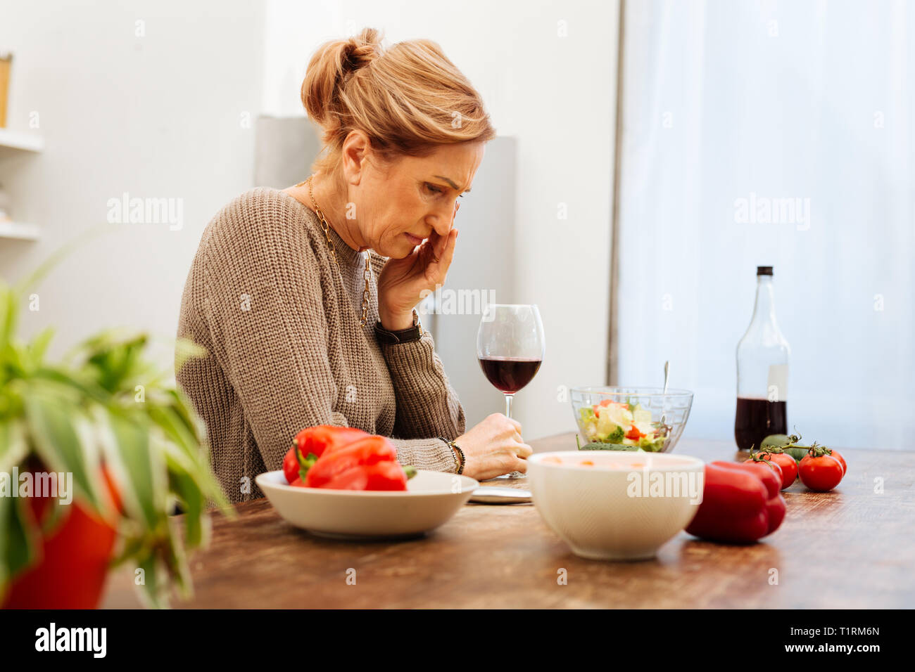 Distressed light-haired woman being depressed with her lifestyle Stock Photo