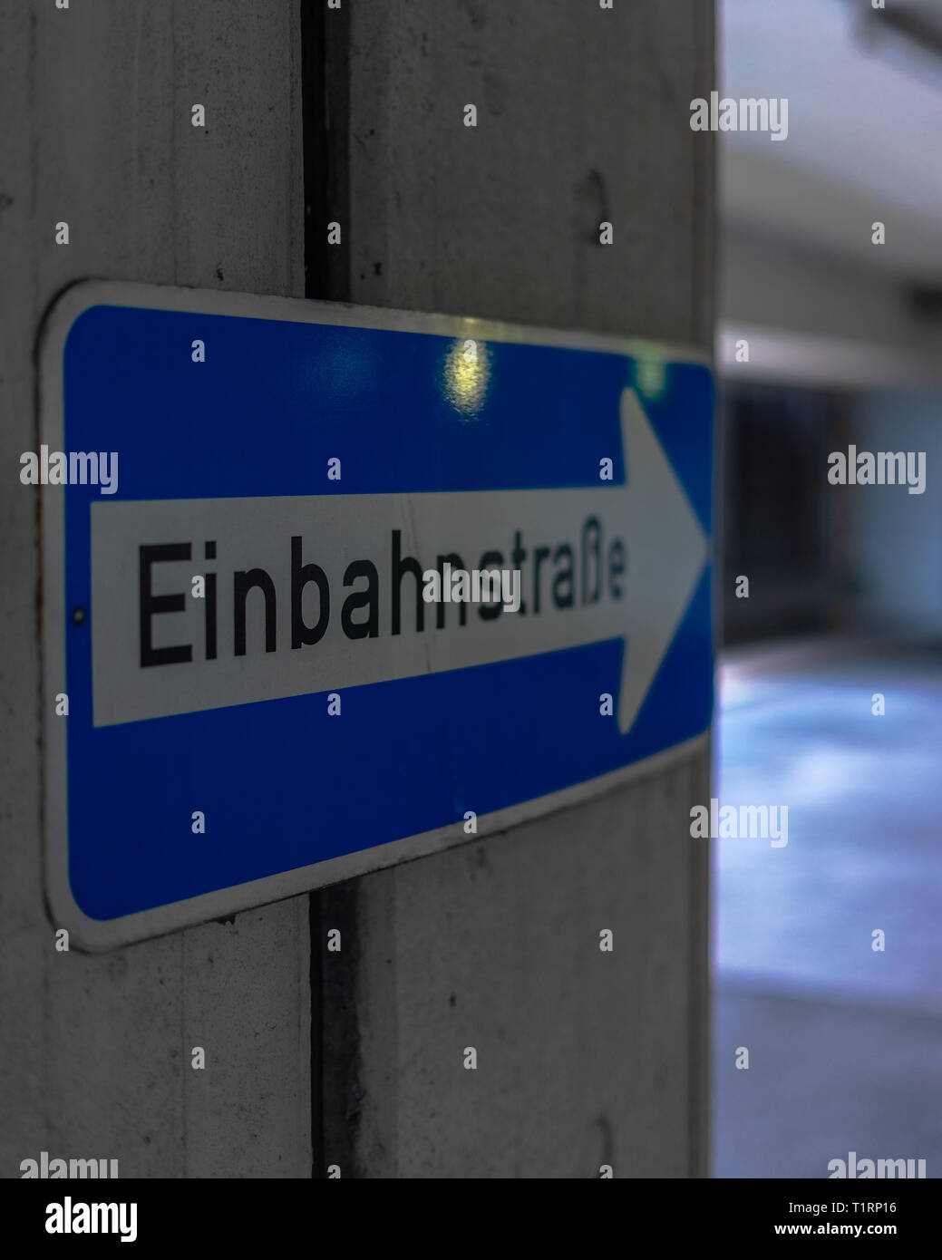 Illuminated information sign exit in the parking garage, old, dirty and ...