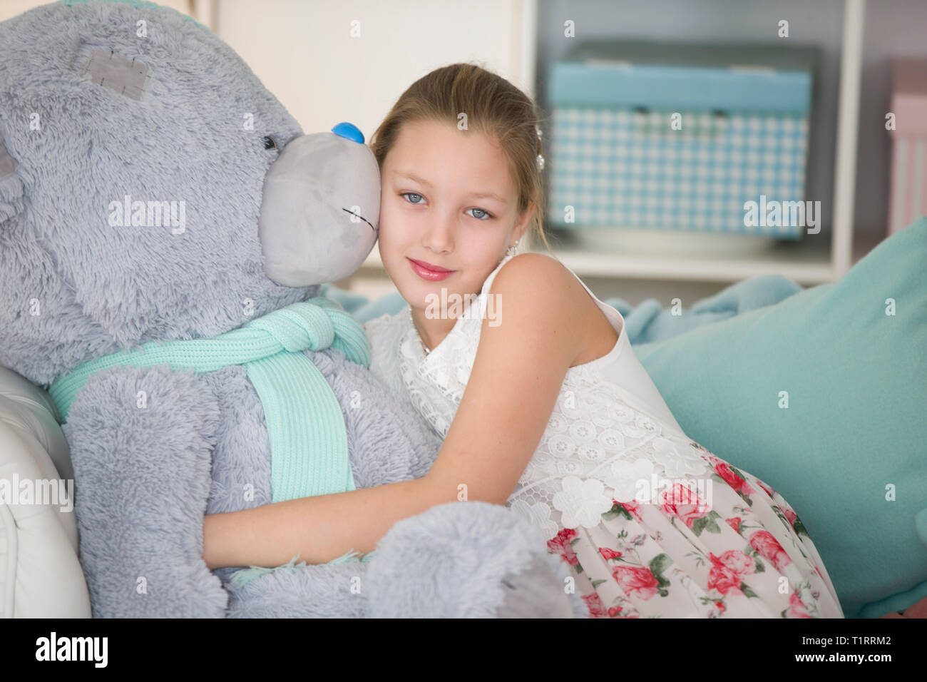 Cute Little Girl With A Huge Teddy Bear Beautiful Teenager With A Soft Toy Stock Photo Alamy