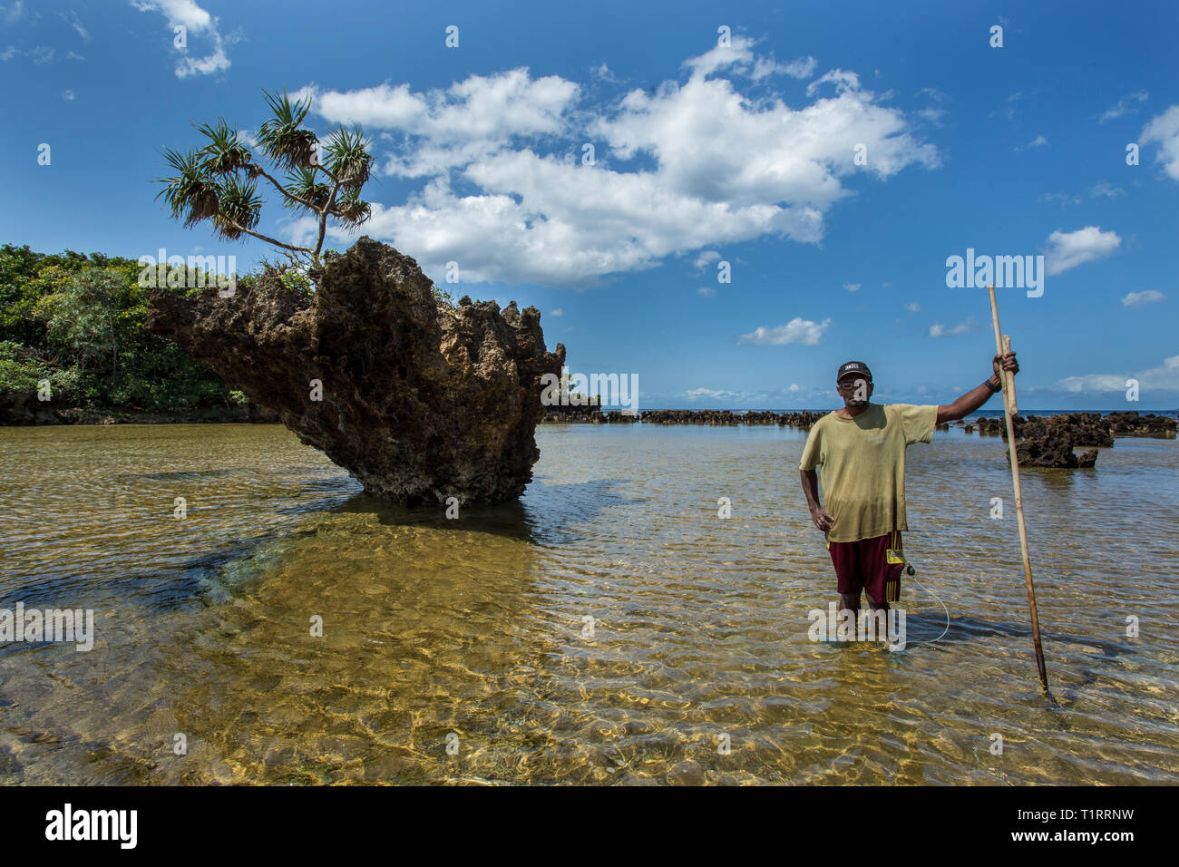 VANUATU, ANIWA ISLAND, TEENAGE BOY FISHING WITH BOW AND ARROW IN LAGOON  Stock Photo - Alamy