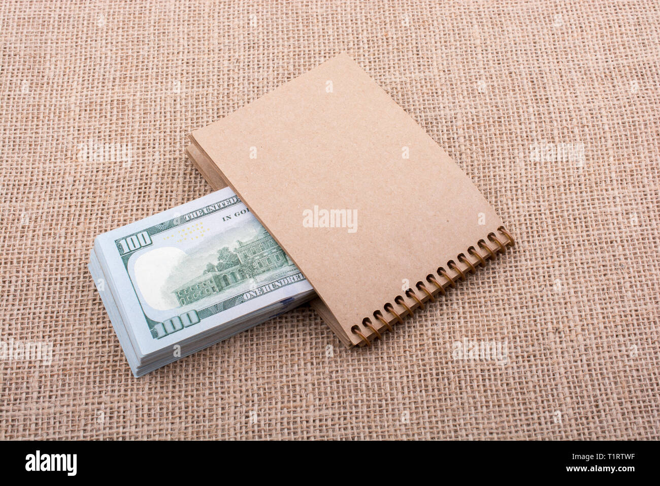 Banknotes Bundle Banknote bundle of US dollar placed on a notebook Stock Photo - Alamy