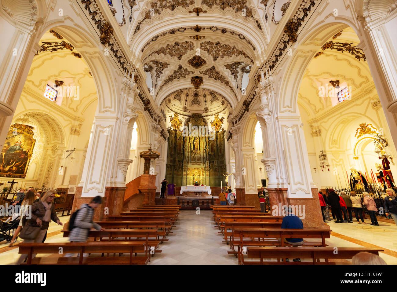The nave in the interior of the Iglesia de Santiago (Church of Santiago), the oldest Roman Catholic church in Malaga, Andalucia, Spain Europe Stock Photo