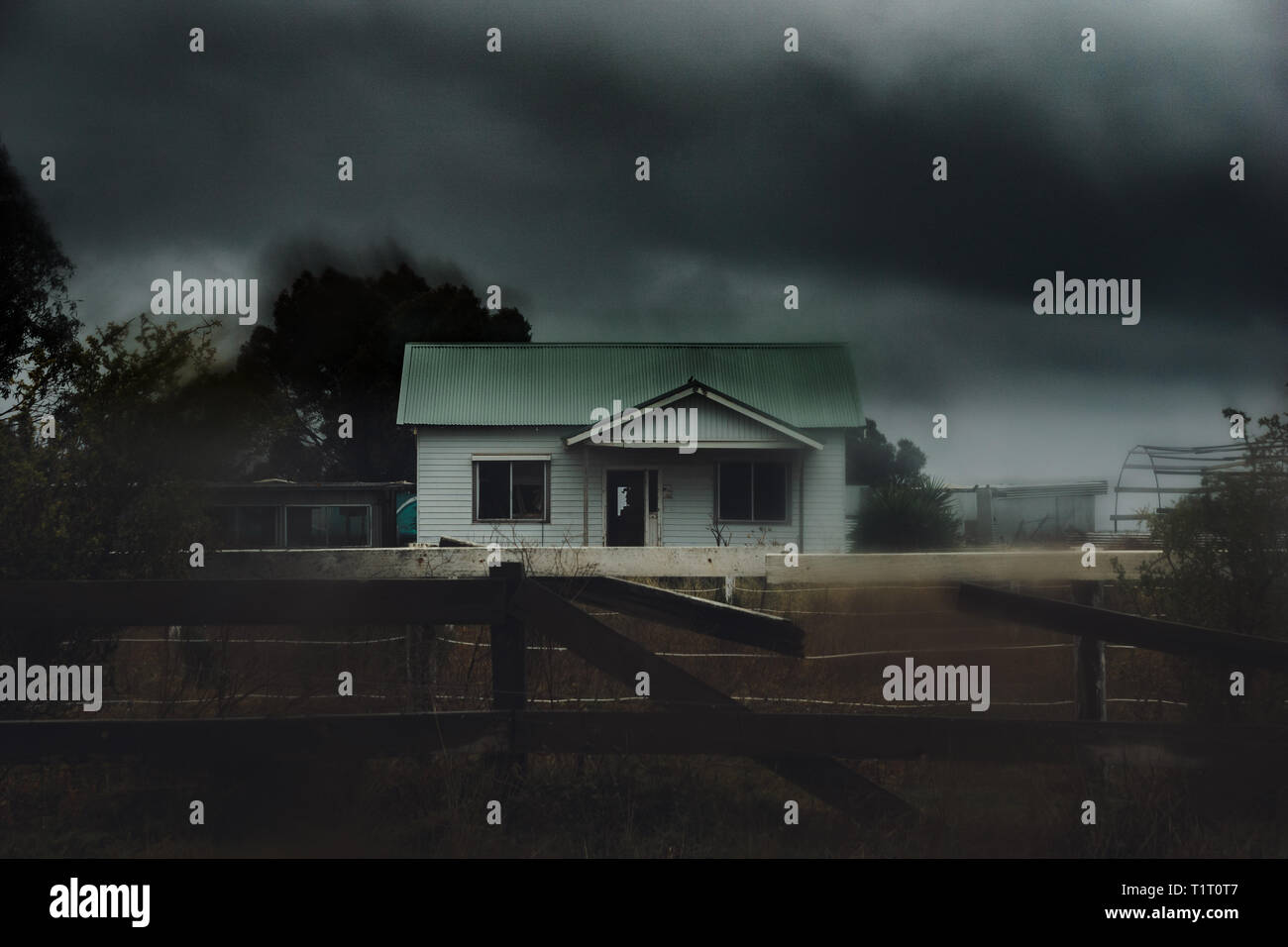 Dark and scary dilapidated abandoned house in the rain Stock Photo - Alamy