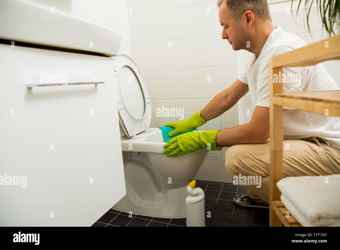 Person cleaning the toilet hires stock photography and images Alamy