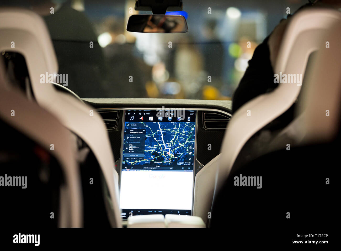 HELSINKI, FINLAND - NOVEMBER 04, 2016: The interior of a Tesla Model X electric car with large touch screen dashboard.  Seats. Stock Photo