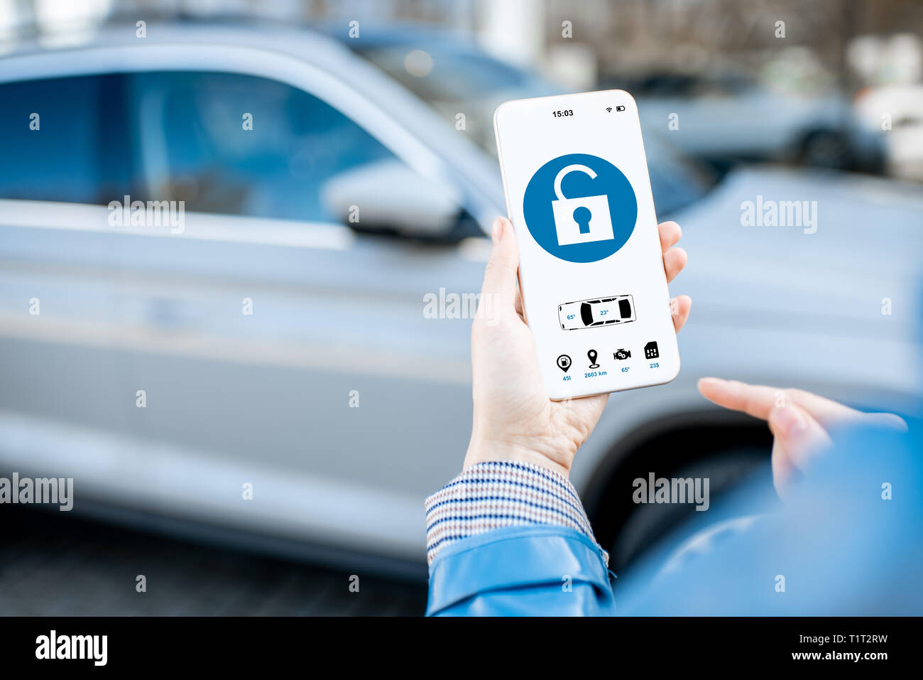 Unlocking car using mobile application on a smart phone. Concept of