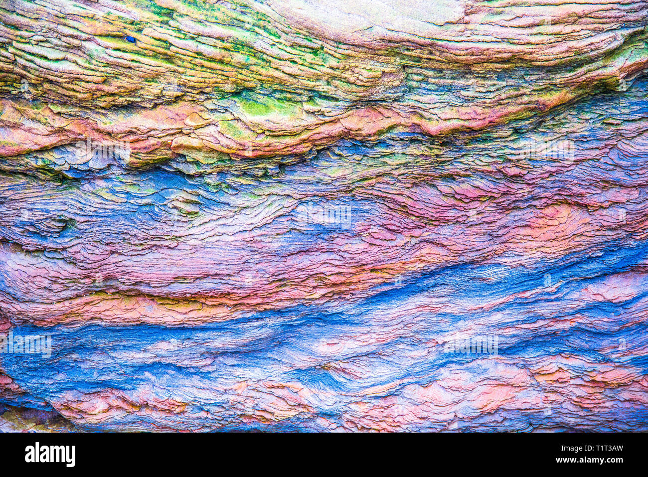 Blue, green, orange sediments and minerals, rock formations - a ...